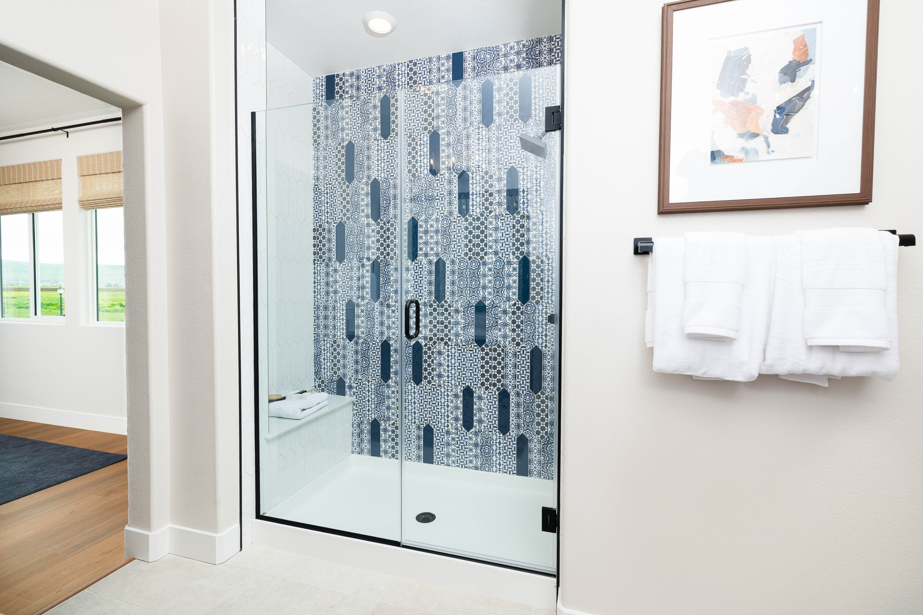 Full-view black handle frameless shower door installation