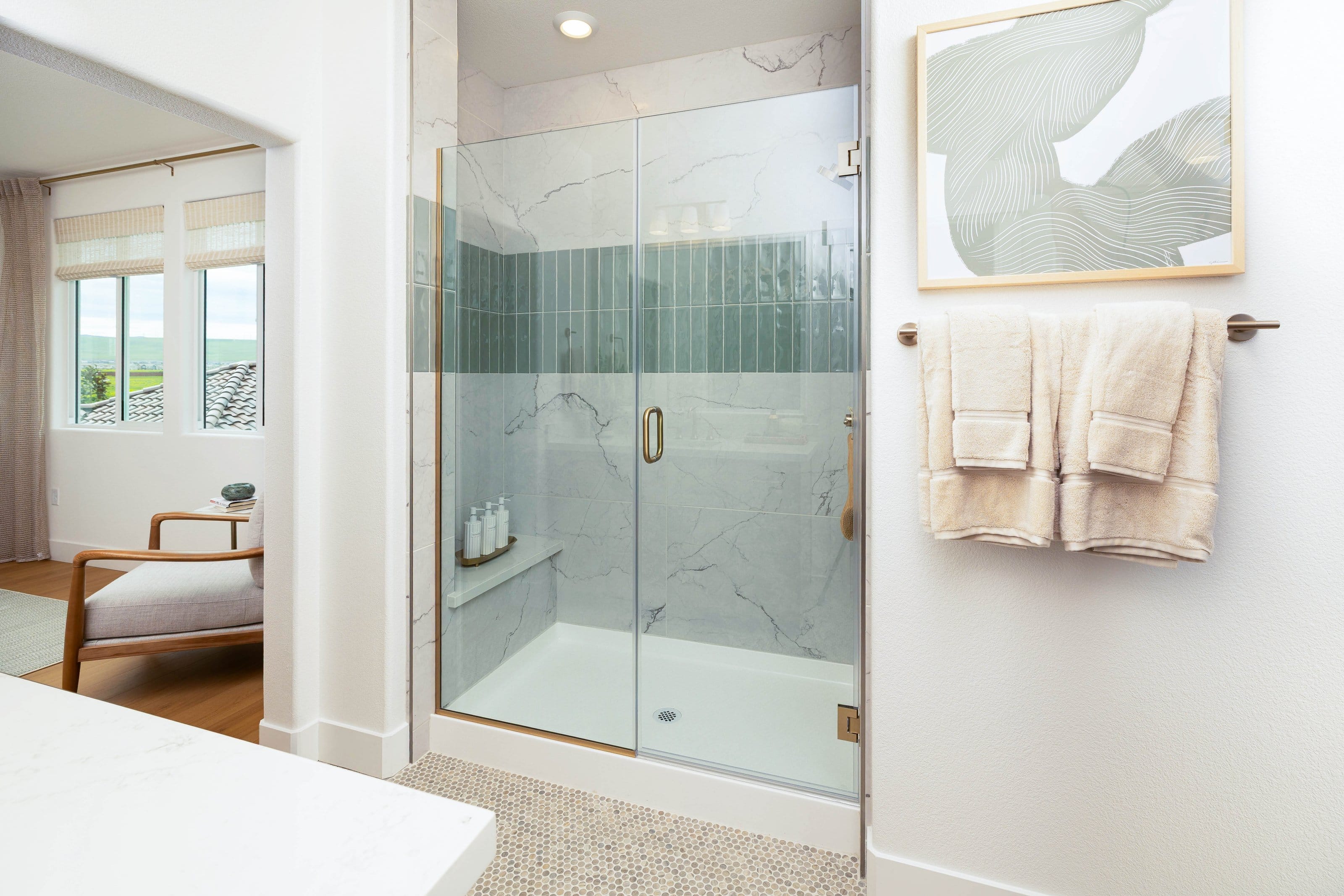 Gold minimalist frameless shower door installation